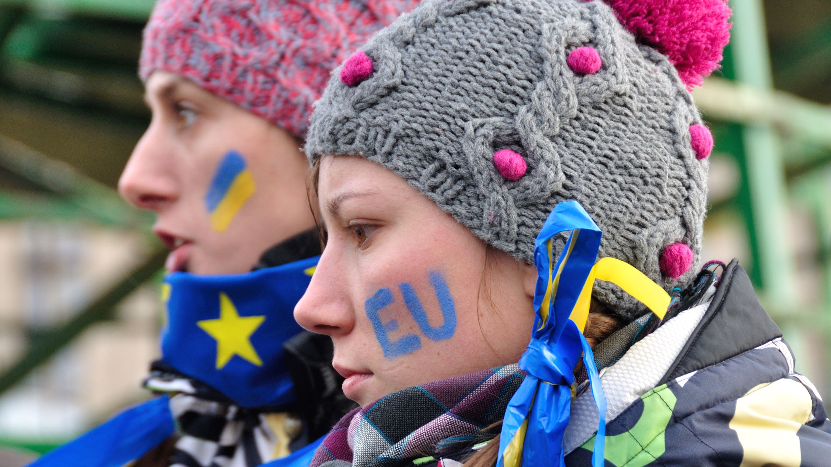 Picture of people wearing Ukraine and EU flags
