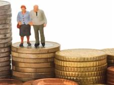 Older couple standing on coins