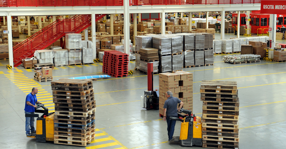 A warehouse with forklift drivers.